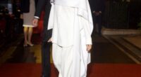 Meghan paired her outfit with black pointed-toe heels and simple accessories, giving off a vibe of effortless elegance, topped off with a sleek, slicked-back bun