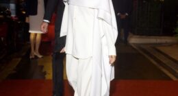 Meghan paired her outfit with black pointed-toe heels and simple accessories, giving off a vibe of effortless elegance, topped off with a sleek, slicked-back bun