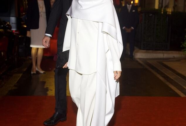 Meghan paired her outfit with black pointed-toe heels and simple accessories, giving off a vibe of effortless elegance, topped off with a sleek, slicked-back bun