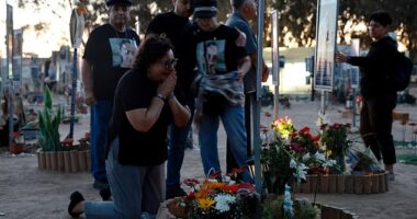 Israelis gather to mark its darkest day. Some said prayers while others shed tears