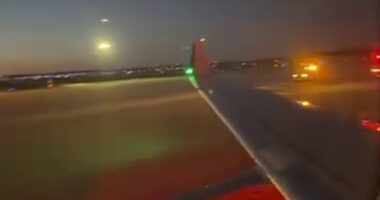 Pictured: Police cars arrive at Eppley Airfield in Omaha, Nebraska, after Flight 6569 made an emergency landing. The pilots mistook banging on the cockpit doors from the flight attendants as a possible hijacking attempt