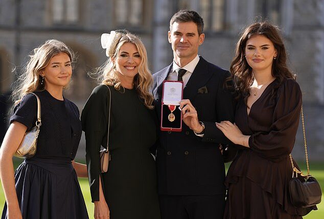 England legend James Anderson has received his knighthood from Princess Anne during a ceremony at Windsor Castle. Pictured with wife Daniella (second left) and daughters Lola and Ruby