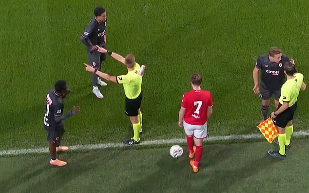 Referee Lothar D'Hondt abandoned the match after being hit with a cup thrown from the stands