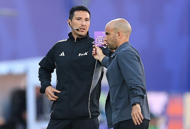 The first ever 'green card' in football history has been shown - even though it looks purple!