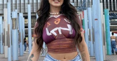 Adult content creator Arabella Mia, 27, was booted out of the Accor Stadium on Sunday when she arrived wearing nothing but body paint to support the Broncos at the NRL Grand Final.