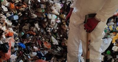 Ben Giles, who founded his extreme cleaning company, Ultima, in 2000, realised early on there was serious money to be made from saying yes to jobs other cleaners wouldn't consider are the grounds they were too gruesome (Pictured: Sorting through piles of rubbish inside a hoarders' house)