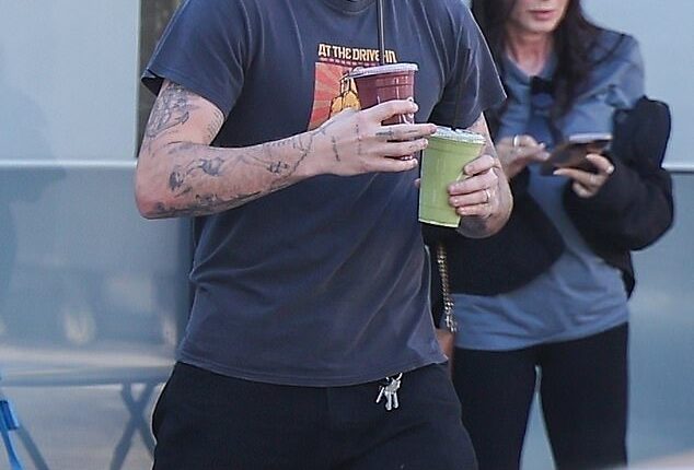 Brooklyn Beckham cut a casual figure as he picked up two smoothies from Earth Bar during an outing in Los Angeles on Wednesday