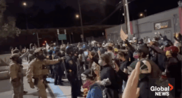 Antifa protesters push against police during a demonstration in Portland.