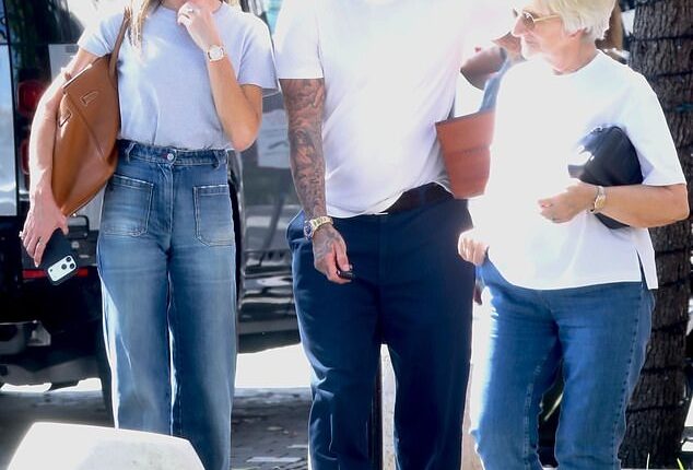 David and Victoria Beckham enjoyed an alfresco lunch with his mother Sandra (right) and father Ted in Miami on Sunday as a row with their neighbours rages on back in the UK