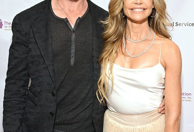 Denise Richards' ex Aaron Phypers has been arrested outside of court over charges of 'spousal abuse' on Friday amid their ongoing divorce battle; seen in May in Universal City