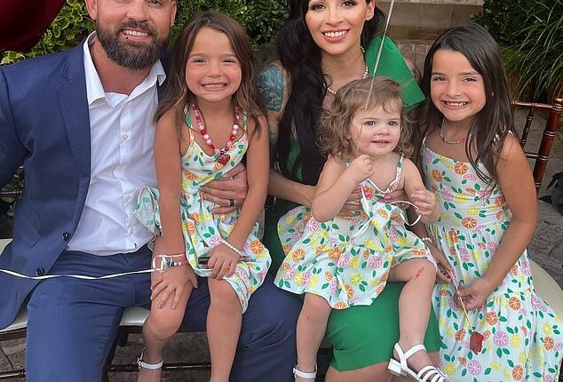 Christopher Scholtes is said to have been watching porn while his two-year-old daughter Parker (pictured above being held by her mother Erika) died in a hot car