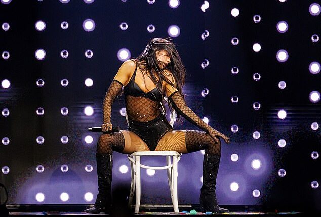 Dua Lipa turned up the heat in an array of racy outfits as she performed at the Kia Forum in LA on Sunday