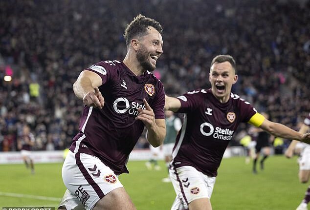 Defender Craig Halkett celebrates his late derby winner with Lawrence Shankland