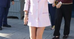 Emma Watson looked carefree as she stepped out at a Paris Fashion Week event days after being branded 'ignorant of how ignorant she is'