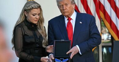 US President Donald Trump and Erika Kirk (L), Charlie Kirk's widow, participate in a Medal of Freedom Ceremony for late US right-wing activist Charlie Kirk in the Rose Garden