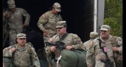 On October 7, a picture taken by the AP showing Texas National Guard troops arriving outside of Chicago, Illinois, went viral