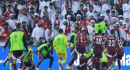 Chaos broke out in Doha on Tuesday night as Qatar secured their place in next summer's World Cup with a win against the UAE