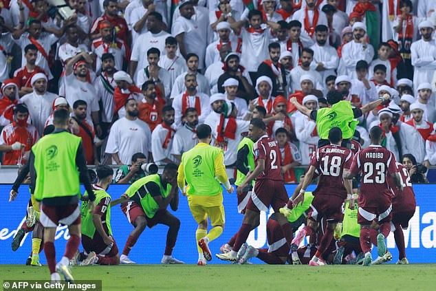 Chaos broke out in Doha on Tuesday night as Qatar secured their place in next summer's World Cup with a win against the UAE