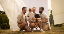 A gay 'throuple' who have adopted a three-year-old girl have launched a lawsuit demanding that their home state of Quebec legally recognizes them as parents
