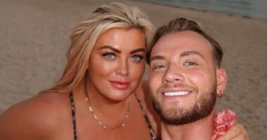 Gemma Collins, 44, looked radiant and glowing in a stunning beachfront snap as she posed with TOWIE star Harry Derbidge in Dubai on Wednesday