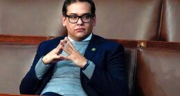 Then-Rep. George Santos, R-N.Y., waits for the start of a session in the House chamber in Washington, Jan. 6, 2023, just after being sworn in. He was later expelled after allegations of fraud were revealed - infractions which later led to his arrest and seven-year prison sentence