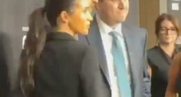This is the moment Meghan Markle appears to ask Prince Harry to move his hand off her bottom as more footage emerges from their awkward New York red carpet appearance