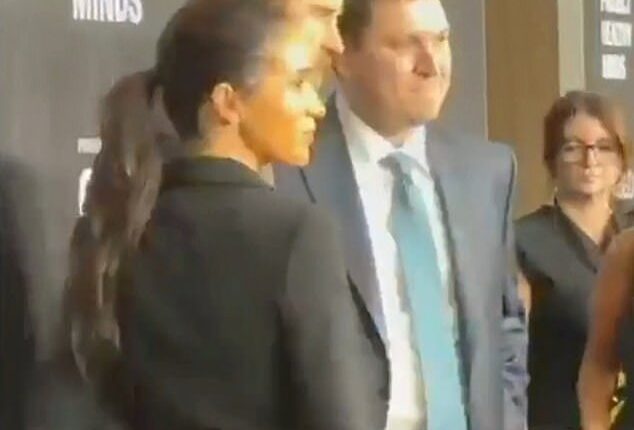 This is the moment Meghan Markle appears to ask Prince Harry to move his hand off her bottom as more footage emerges from their awkward New York red carpet appearance