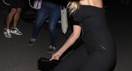 She looked in good spirits as she sported a pair of large aviator sunglasses as she stepped off the pavement losing her balance after the night out