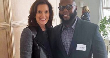 Leon El-Alamin (pictured right with Whitmer, left) faces charges of domestic battery and assault for allegedly beating his girlfriend