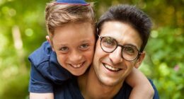 Yoni Finlay (right) saved lives by helping to barricade the door of Heaton Park Hebrew Congregation Synagogue during Thursday's terrorist attack, his son Uriel (now 15) said