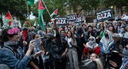 Protestors are pictured after descending on Parliament Square, London, hours after two people were killed in a 'barbaric' knife attack outside the Heaton Park Synagogue in Manchester