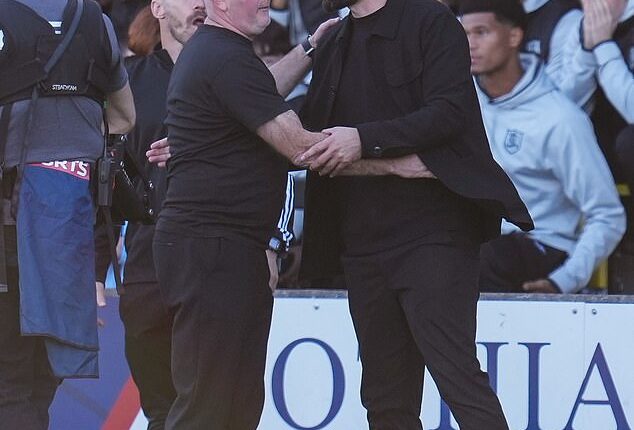 Russell Martin is embraced by Livi boss David Martindale after Sunday's away victory