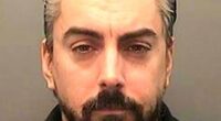 The inmate who killed paedophile Ian Watkins, pictured, in his prison cell is believed to have been 'serving time for murder'