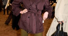 Joanna Lumley in a short brown trench at the Burberry Spring/Summer 2026 show during London Fashion Week in September