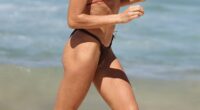 Indy Clinton, 28, stripped down to a tiny bikini on Friday as she flaunted her very toned abs at Bondi Beach