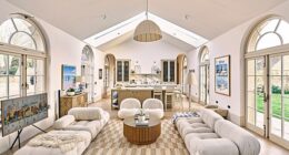 The new open-plan kitchen extension features orangery-style arched windows. A secret pantry area is concealed behind the kitchen and houses the couple’s fridge freezer and dishwasher, as well as further storage. The sofas are from B&B Italia.