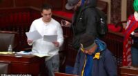 Christopher Moynihan, in white, a man pardoned by President Donald Trump for his role in the 2021 Capitol riot, has been charged with threatening to kill the top Democrat in the US House of Representatives