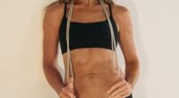 Jennifer Aniston has been seen in two new photos as she promote Pvolve. The Friends actress flashed her very strong abs as she wore a black sports bra and matching leggings with her blonde hair down