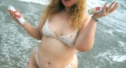 Honey Ross showed off her incredible figure in a white bikini as she posed for an Instagram photo in the ocean on Sunday while holding up her favourite skincare products