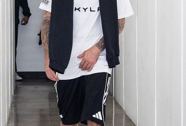 Justin Bieber, 31, was seen embracing both his wife Hailey and close friend Kendall Jenner as the trio watched singer Dijon perform at a San Diego concert on Saturday; seen earlier this month in L.A.