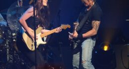 Keith Urban has shocked fans by changing the lyrics of his song about Nicole Kidman romance to include the name of his new female guitarist Maggie Baugh (pictured on stage in 2024)