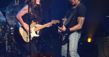 Keith Urban has shocked fans by changing the lyrics of his song about Nicole Kidman romance to include the name of his new female guitarist Maggie Baugh (pictured on stage in 2024)