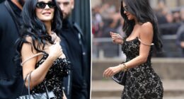 Kylie Jenner exposes bra strap with sheer lace Miu Miu dress during Paris Fashion Week