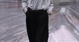 Sunday Rose Kidman-Urban, 17, in a grey blouse, black neck tie and black pleat-fronted trousers, appeared on the catwalk