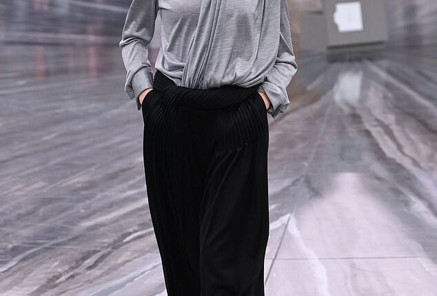 Sunday Rose Kidman-Urban, 17, in a grey blouse, black neck tie and black pleat-fronted trousers, appeared on the catwalk