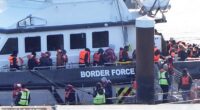 Migrants arrive aboard a Border Force vessel at Dover on Wednesday, when a total of 1,075 arrived across the Channel by small boat