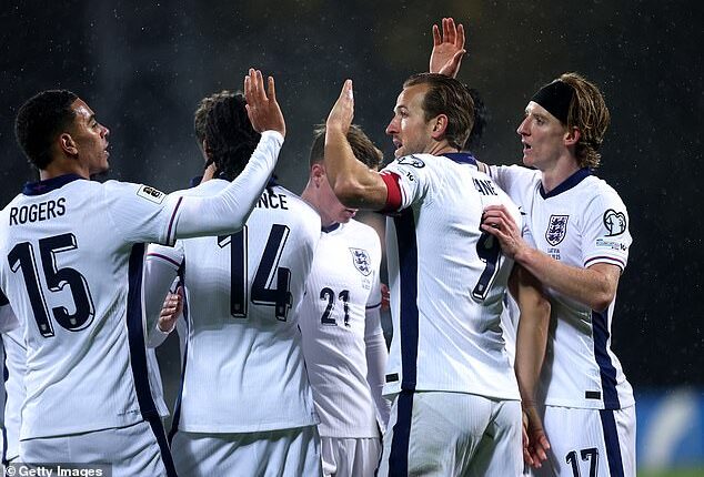 England sealed qualification to the World  Cup next summer with a huge 5-0 win over Latvia