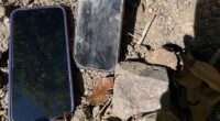 A pair of stolen phones found buried in the shallow dirt of the Phoenix Garden in London's West End