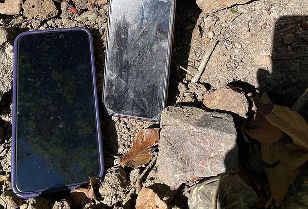 A pair of stolen phones found buried in the shallow dirt of the Phoenix Garden in London's West End