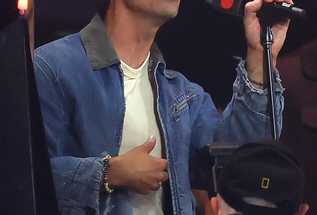 Joe Jonas performs with his brothers following the fifth inning on Saturday night